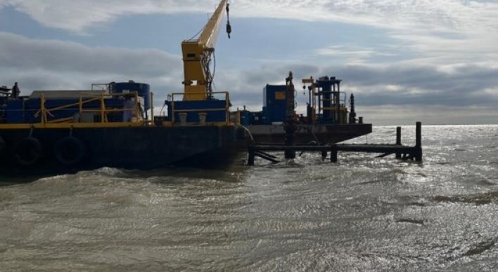 Plugging barge onsite at orphan well in Trinity Bay
