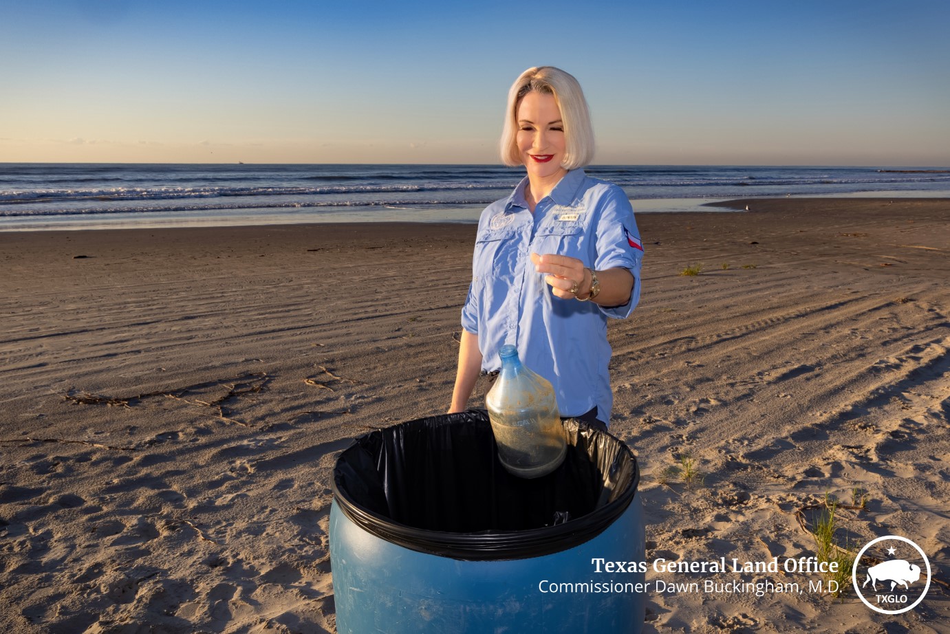 Commissioner Buckingham cleans the beach during Adopt-A-Beach Coastwide Cleanup