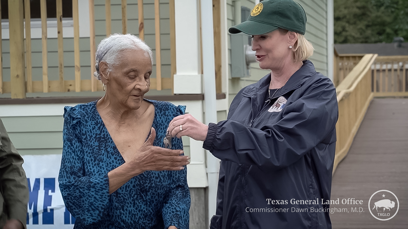 Commissioner Buckingham hands keys to new home to Ms. Earnestine Henry