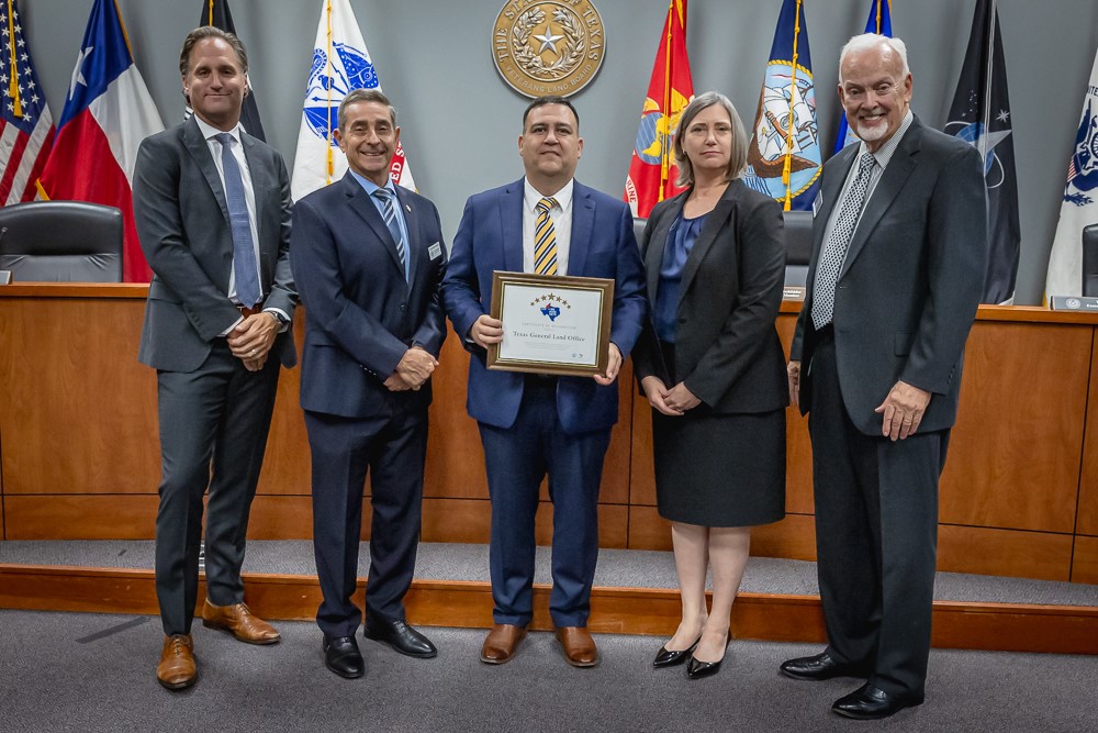 Texas Workforce Commission (TWC) presents the Texas General Land Office (GLO) with a certificate recognizing the GLO's participation in the 'We Hire Vets' program.