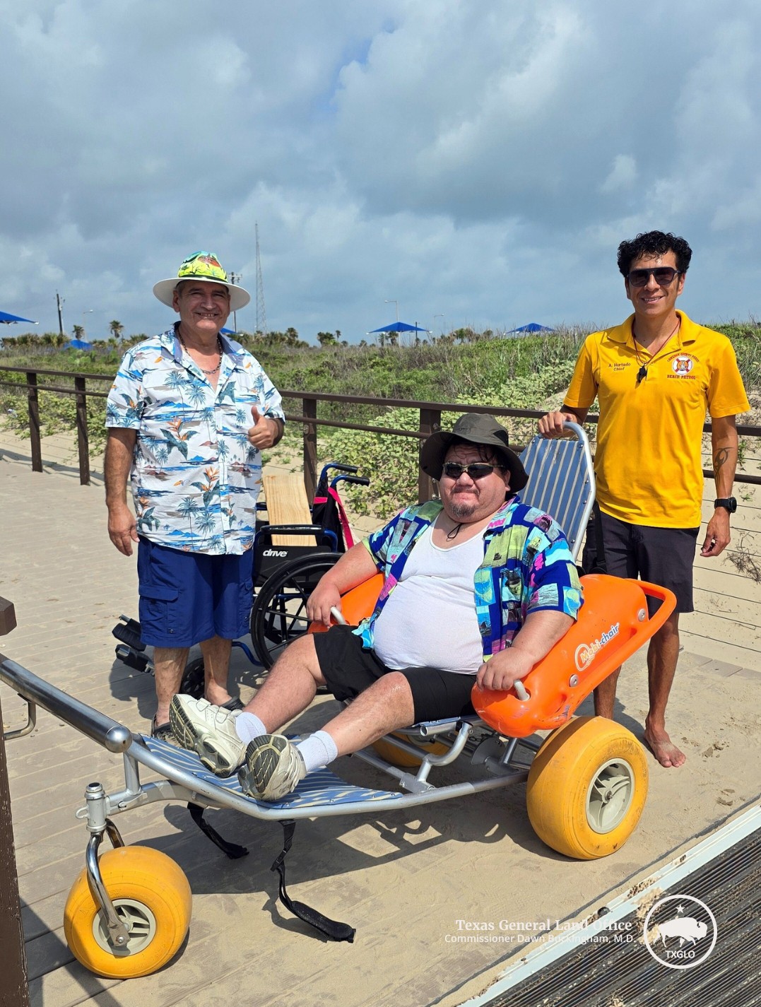 Texans enjoy the beach in Cameron County aided by a beach wheelchair