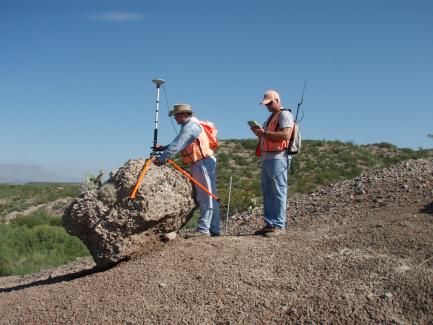 Image of two people on Mark Holmes Rock.