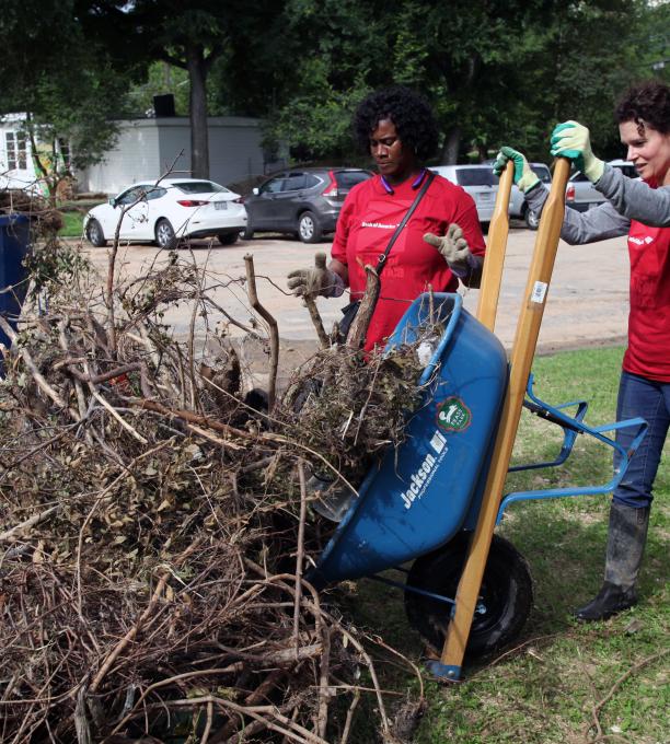 Volunteers remove debris in Pease Park as part of recovery efforts from a major Memorial Day flood.